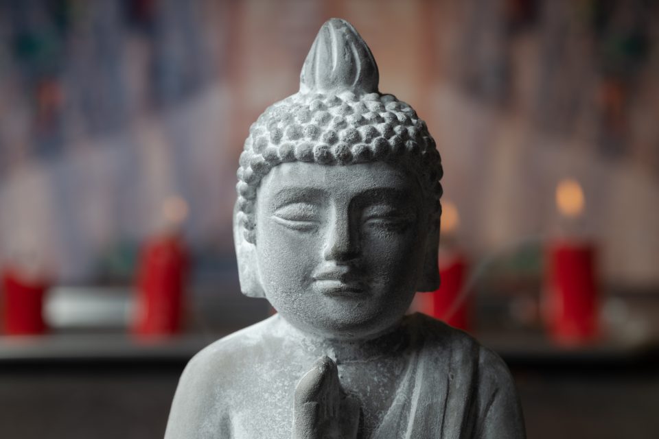 stone-statue-of-buddha-on-a-stone-window-sill-surr-2023-11-27-05-07-31-utc